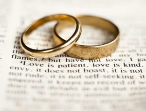 Marriage: Wedding rings over Bible